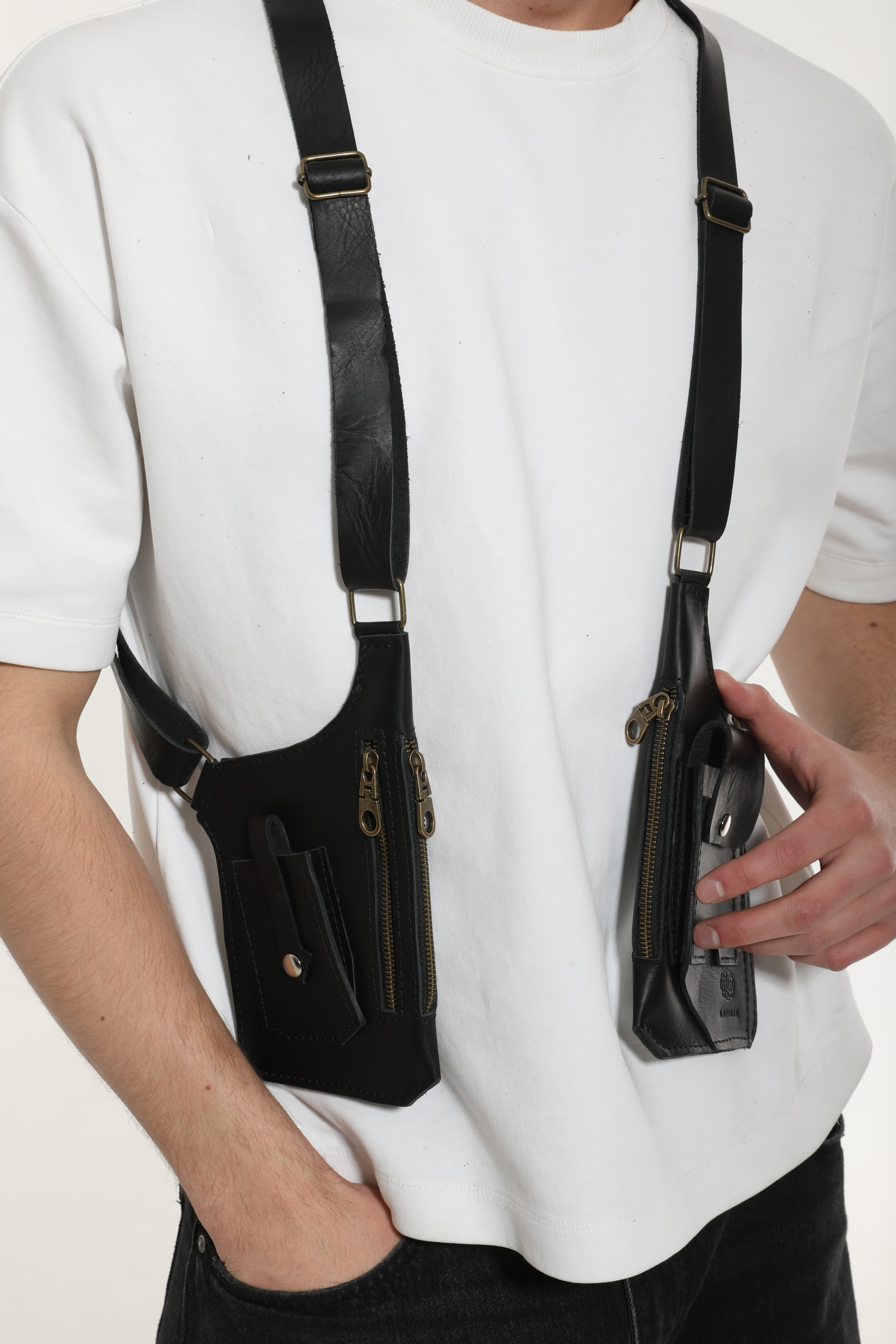 Model wearing a Kankia black leather double shoulder holster bag
